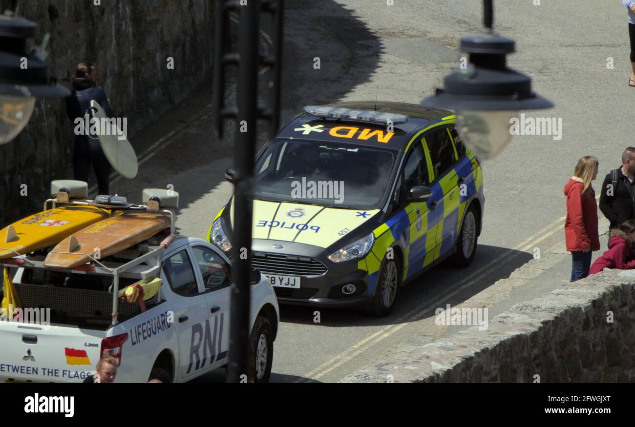 Cornwall UK, Newquay`s Towan beach, A strange head to head as London Transport police in a distinctive vehicle come head to head with Cornish beach culture. five thousand five hundred officers are being drafted in from across the country to police the G7 Conference at Carbis Bay. 22nd May 2021. Credit: Robert Taylor/Alamy Live News Stock Photo